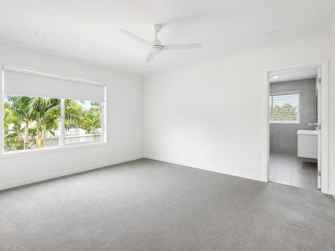 The same bedroom empty, before staging